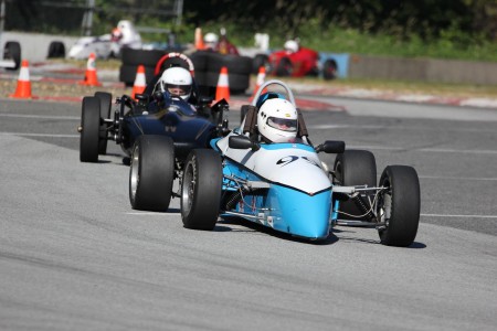 Tedd takes over the lead! New for 2014 VRCBC President Tedd McHenry (XPit F4) shows former president Stanton Guy (Caldwell FVee) how it's done. - Brent Martin photo