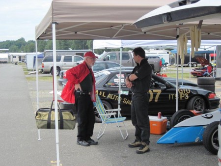 'A word from the wise." Former VRCBC president Jim Latham (L) reminds current president Tedd McHenry to always check the schedule before heading to the track. - VRCBC photo