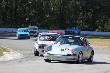 David Hogg (Porsche 911) holds off Ian Thomas (BMW 2002) and an almost hidden Mike Hawthorne (Porsche 944) through Mission's Turn 5 with Leigh Anderson (BMW 1600), Ian Wood (Volvo 142S) and Paul Haym (Datsun 510) in hot pursuit. - Brent Martin photo