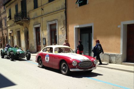 Two classics motor down a classic Italian village street during the 2016 Mille Miglia. - Ann Peters photo