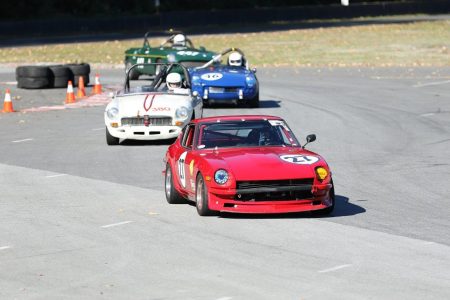 A typical Vintage racing battle: twelve (3 X 4) British cylinders chase six (younger) Japanese ones. Phil Linzey (1971 Datsun 240Z) leads Stanton Guy (1966 MGB), Phil Pidcock (1965 Triumph Spitfire) and John Elliott (1969 MGB). - Brent Martin photo